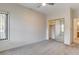 Bright bedroom with mirrored closet doors and ceiling fan at 7923 Canoe Ln, Las Vegas, NV 89145