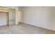 Simple bedroom with mirrored closet doors and neutral walls at 7923 Canoe Ln, Las Vegas, NV 89145