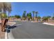 Gated community entrance with palm trees at 7923 Canoe Ln, Las Vegas, NV 89145