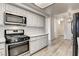 Eat-in kitchen with stainless steel appliances and light colored cabinets at 7923 Canoe Ln, Las Vegas, NV 89145