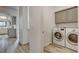 Laundry room with washer, dryer, and cabinets at 7923 Canoe Ln, Las Vegas, NV 89145