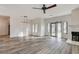 Large living room with sliding glass doors and a fireplace at 7923 Canoe Ln, Las Vegas, NV 89145