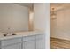 Clean wet bar with gray cabinets and white countertop at 7923 Canoe Ln, Las Vegas, NV 89145