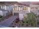 Modern home with solar panels and landscaped yard, aerial view at 8 Hilltop Crest St, Henderson, NV 89011