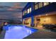 Stunning backyard with pool and patio at dusk at 8 Hilltop Crest St, Henderson, NV 89011