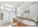 Bathroom with dual sinks and a bathtub at 8 Hilltop Crest St, Henderson, NV 89011