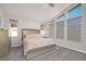 Bright bedroom featuring high ceilings, stylish blinds, and a comfortable bed at 8 Hilltop Crest St, Henderson, NV 89011