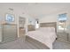 Calm bedroom showcasing neutral tones, plush carpeting, and large windows at 8 Hilltop Crest St, Henderson, NV 89011