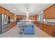 Modern kitchen with stainless steel appliances and a large center island at 8 Hilltop Crest St, Henderson, NV 89011