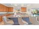Close-up view of the kitchen island with granite countertops and comfortable bar stools at 8 Hilltop Crest St, Henderson, NV 89011