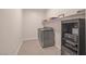 Laundry room with washer, dryer, and shelving at 8 Hilltop Crest St, Henderson, NV 89011