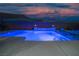 Blue-lit pool and patio at night at 8 Hilltop Crest St, Henderson, NV 89011