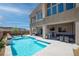 Expansive pool and patio area with fire pit at 8 Hilltop Crest St, Henderson, NV 89011