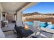 Relaxing poolside patio with fire pit and seating at 8 Hilltop Crest St, Henderson, NV 89011