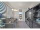 Sitting room with comfortable seating, built-in storage, and access to a balcony at 8 Hilltop Crest St, Henderson, NV 89011