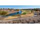 Aerial view of golf course community with lake at 8120 Castle Pines Ave, Las Vegas, NV 89113