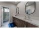 Double vanity bathroom with modern finishes and a shower at 8120 Castle Pines Ave, Las Vegas, NV 89113