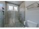 Clean bathroom with pebble floor shower and glass enclosure at 8120 Castle Pines Ave, Las Vegas, NV 89113