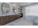 Bathroom boasts double vanity and a large soaking tub at 8120 Castle Pines Ave, Las Vegas, NV 89113