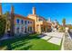 Back exterior view showing patio and lush landscaping at 8120 Castle Pines Ave, Las Vegas, NV 89113