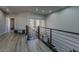 Upstairs hallway with modern flooring and bench seating at 8120 Castle Pines Ave, Las Vegas, NV 89113