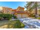 Front view of two-story house with two-car garage at 8120 Castle Pines Ave, Las Vegas, NV 89113