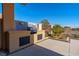 Outdoor kitchen with built-in grill and stone accents at 8120 Castle Pines Ave, Las Vegas, NV 89113