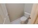 Small half bathroom with white toilet and fixtures at 8353 Stillhouse Ct, Las Vegas, NV 89113