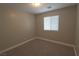 Simple bedroom with neutral walls and carpeted floor at 8353 Stillhouse Ct, Las Vegas, NV 89113