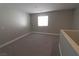 Bright bedroom with carpeted floor and window coverings at 8353 Stillhouse Ct, Las Vegas, NV 89113