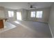 Spacious living room with carpeted floor and large windows at 8353 Stillhouse Ct, Las Vegas, NV 89113