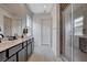 Modern bathroom with double vanity and walk-in shower at 9016 Skye Canyon Ranch St, Las Vegas, NV 89166