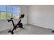 Room with Peloton exercise bike and large window at 9016 Skye Canyon Ranch St, Las Vegas, NV 89166