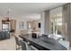 Modern dining room features a large table, and access to backyard at 9016 Skye Canyon Ranch St, Las Vegas, NV 89166