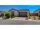 Single-story home with attached garage and well-manicured landscaping at 9016 Skye Canyon Ranch St, Las Vegas, NV 89166