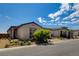 Two story home with attached garage, landscaping, and a paved driveway at 9016 Skye Canyon Ranch St, Las Vegas, NV 89166