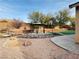 Backyard features a gazebo and a pond with rock landscaping at 9092 National Park Dr, Las Vegas, NV 89178