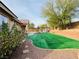 Artificial turf backyard with gazebo and rock landscaping at 9092 National Park Dr, Las Vegas, NV 89178