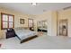 Main bedroom with a king-size bed and mirrored closet doors at 9092 National Park Dr, Las Vegas, NV 89178