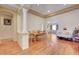 Bright dining area with hardwood floors and a rustic wooden table, set for six at 9092 National Park Dr, Las Vegas, NV 89178