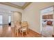 Bright dining room with a wooden table and view of kitchen at 9092 National Park Dr, Las Vegas, NV 89178