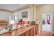 Open hallway with a wooden counter and views into other rooms at 9092 National Park Dr, Las Vegas, NV 89178