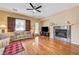 Living room with hardwood floors, fireplace, and view of kitchen at 9092 National Park Dr, Las Vegas, NV 89178