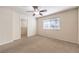 Serene bedroom with carpet flooring, ceiling fan, closet, and a window providing natural light at 9328 Freedom Heights Ave, Las Vegas, NV 89149