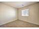 Bedroom with carpet flooring, neutral walls, and a window with blinds at 9328 Freedom Heights Ave, Las Vegas, NV 89149