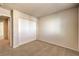 Bedroom with carpet flooring, double-door closet, and views to the hallway at 9328 Freedom Heights Ave, Las Vegas, NV 89149