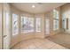 Well-lit dining area with tile flooring, complemented by views of the backyard and a convenient exterior door at 9328 Freedom Heights Ave, Las Vegas, NV 89149