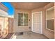 Covered entryway with a secure screen door and a window, offering a welcoming entrance at 9328 Freedom Heights Ave, Las Vegas, NV 89149