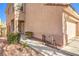 Exterior view of a two-story home with a two-car garage and a landscaped front yard at 9328 Freedom Heights Ave, Las Vegas, NV 89149