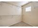 Walk-in closet features wire shelving, neutral walls and carpet flooring at 9328 Freedom Heights Ave, Las Vegas, NV 89149